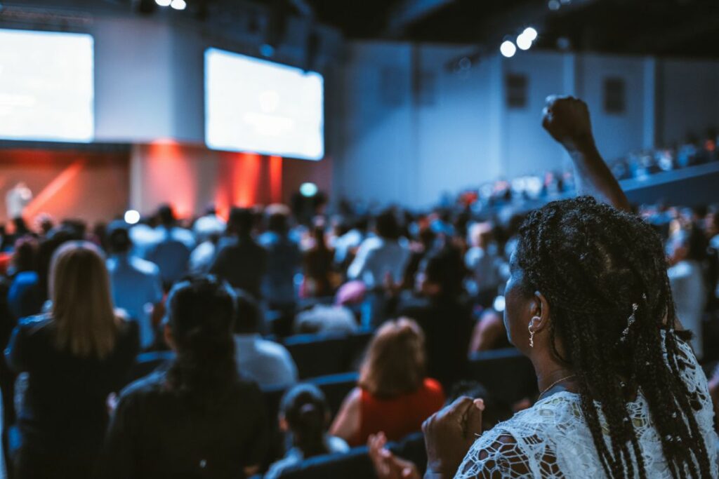 People at a conference talk