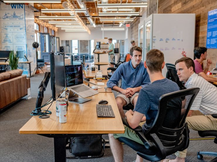 Young men sitting in a coworking space together