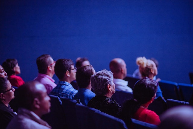 People sitting in the audience at a conference talk.