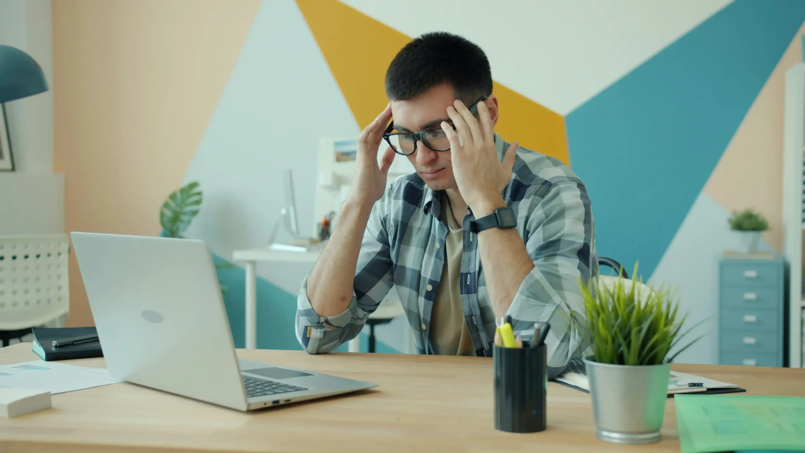 Stressed guy is working with laptop-Employee Burnout